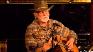 folk singer playing guitar